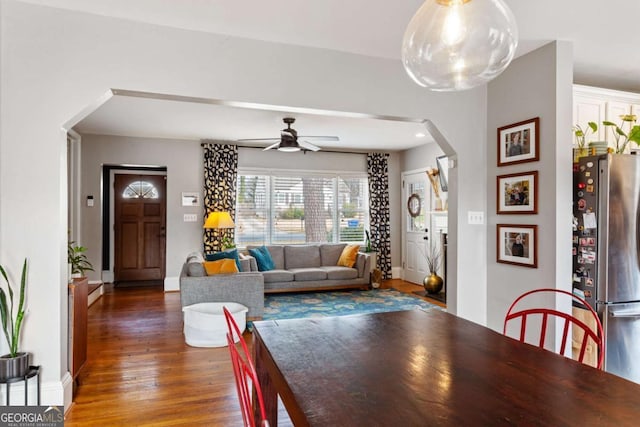 dining room featuring dark wood-type flooring and ceiling fan