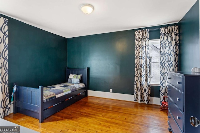 bedroom featuring wood-type flooring