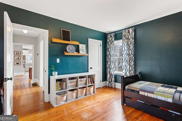 bedroom with hardwood / wood-style flooring