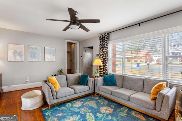 living room with hardwood / wood-style floors and ceiling fan