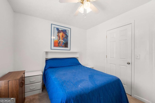 bedroom featuring light carpet and ceiling fan