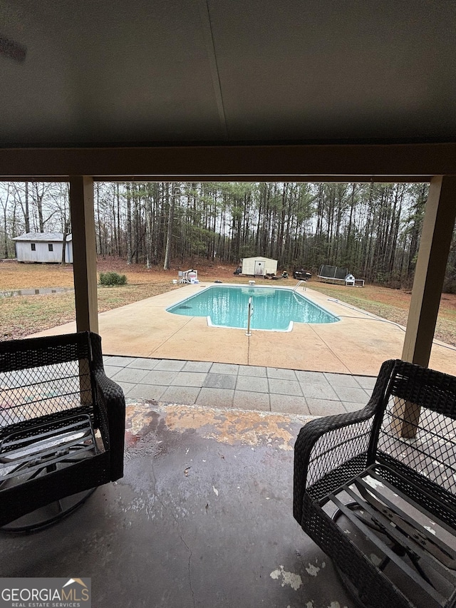 view of swimming pool featuring a patio