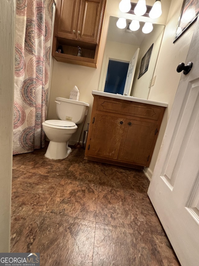 bathroom with vanity and toilet