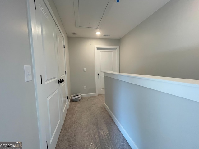 hallway with light carpet