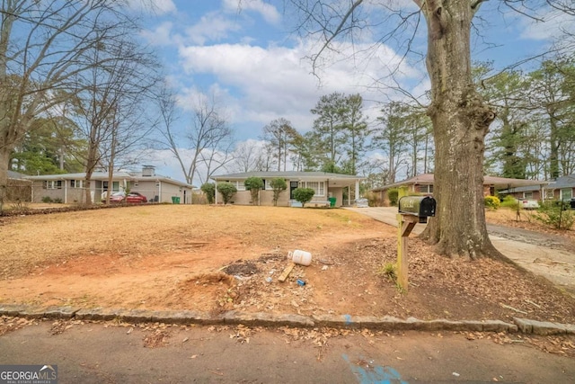 ranch-style home with covered porch