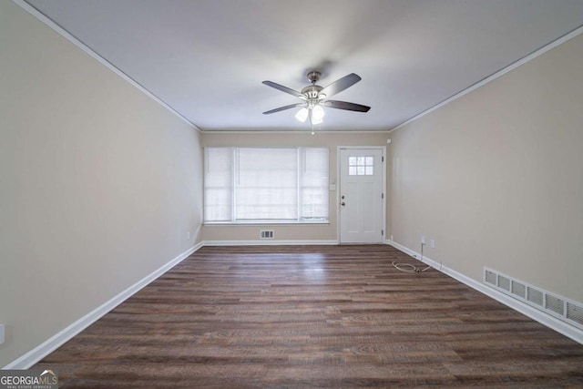 interior space featuring crown molding, ceiling fan, and dark hardwood / wood-style flooring