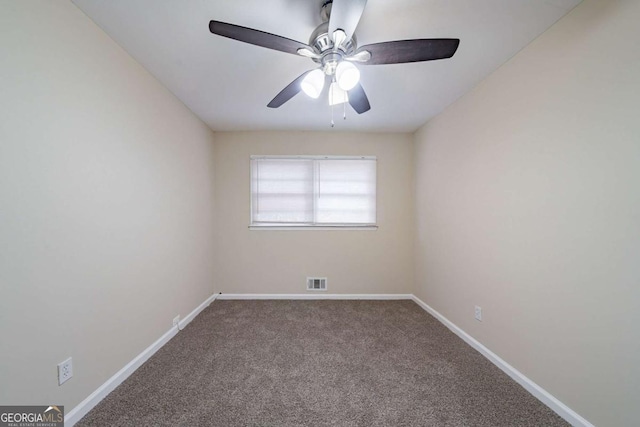 spare room with ceiling fan and carpet floors