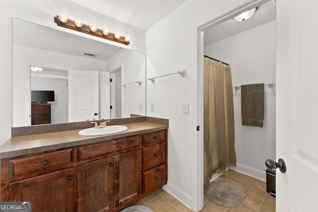 bathroom with tile patterned flooring, vanity, and a shower with curtain