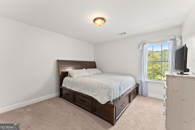 bedroom with light colored carpet