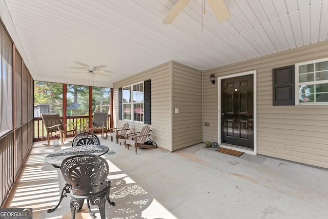 sunroom / solarium with ceiling fan