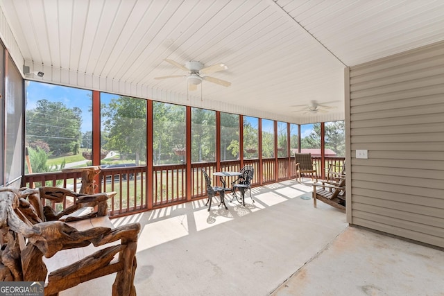 sunroom featuring ceiling fan