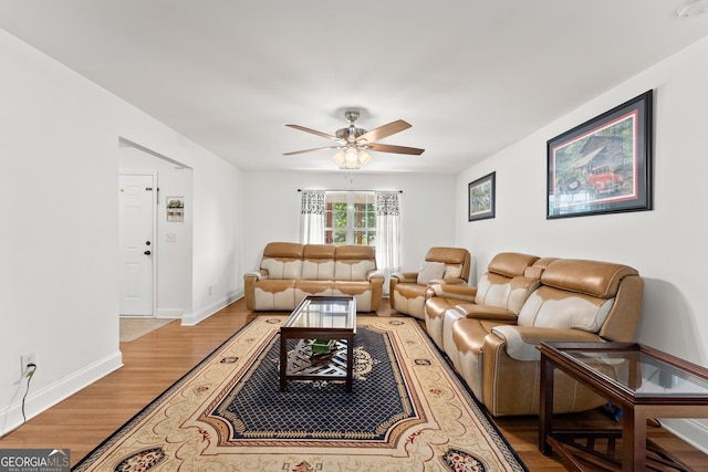 living room with hardwood / wood-style floors and ceiling fan