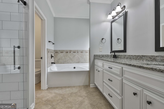 bathroom with toilet, ornamental molding, tile patterned floors, a garden tub, and vanity