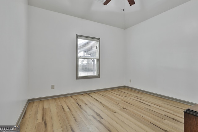 unfurnished room with a ceiling fan, baseboards, and wood finished floors