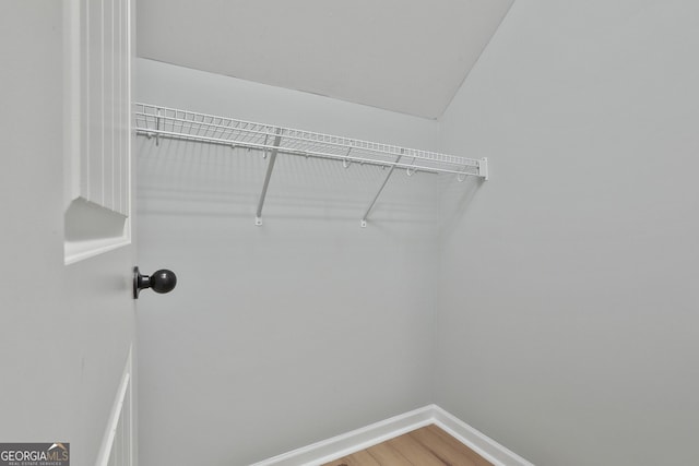 walk in closet featuring light wood finished floors