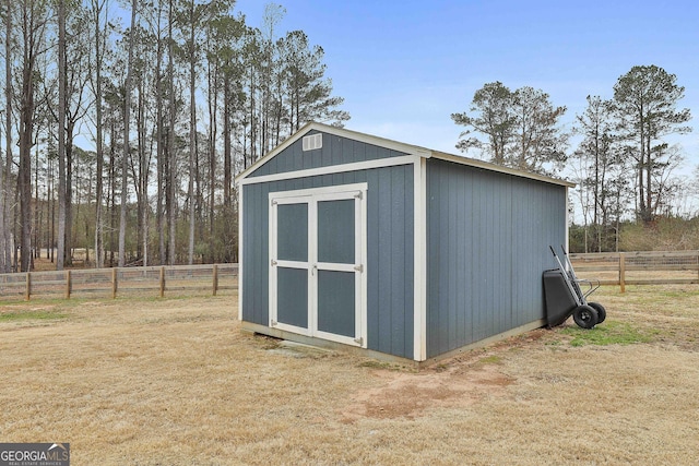 view of shed with fence