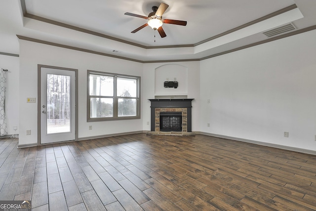 unfurnished living room with ornamental molding, wood finished floors, and visible vents