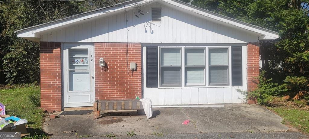 exterior space with brick siding