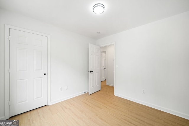 unfurnished bedroom featuring light wood-type flooring