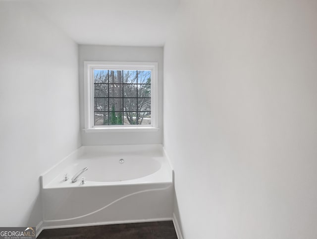 bathroom featuring a washtub