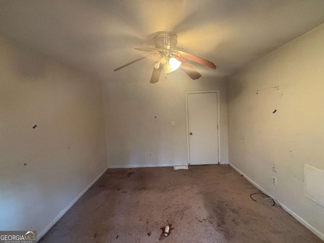 unfurnished room featuring ceiling fan and carpet floors