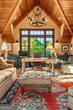 interior space with wooden ceiling, an inviting chandelier, and vaulted ceiling