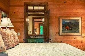 bedroom with wood walls