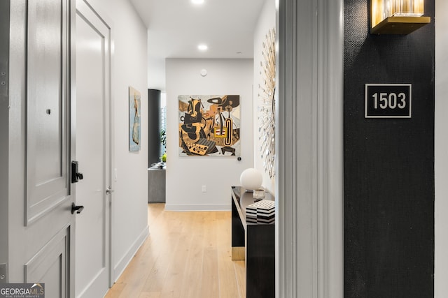 hall with light wood-type flooring