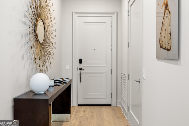 doorway to outside featuring light hardwood / wood-style flooring