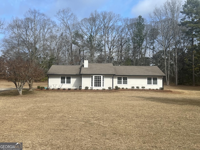 ranch-style house with a front yard