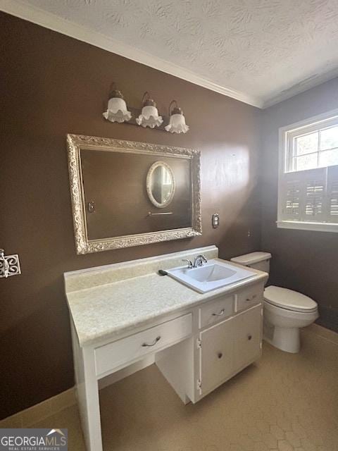 bathroom with vanity, a textured ceiling, and toilet