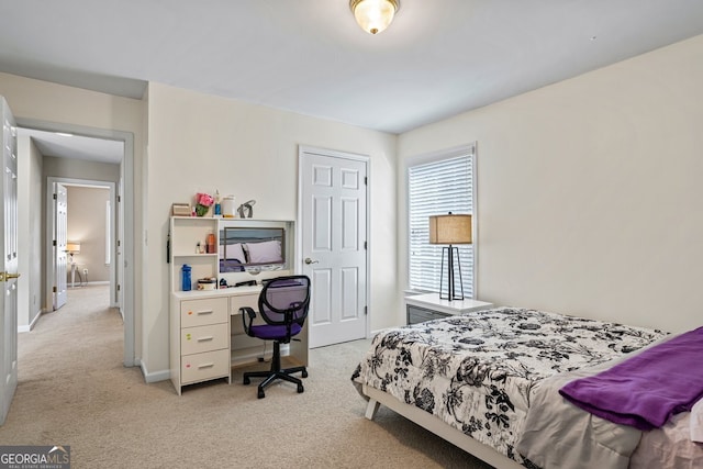 bedroom with light carpet