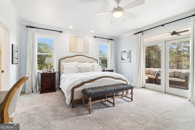 carpeted bedroom with crown molding, access to exterior, and ceiling fan