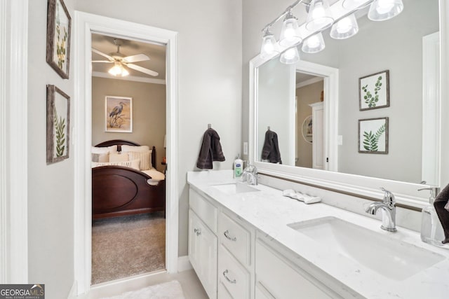 bathroom with vanity, crown molding, and ceiling fan