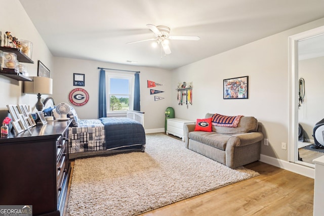 bedroom featuring hardwood / wood-style floors and ceiling fan