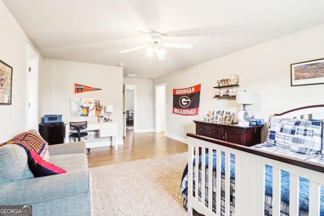 bedroom with ceiling fan and light hardwood / wood-style flooring