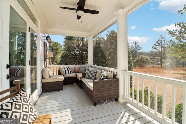 sunroom / solarium with wood ceiling and ceiling fan