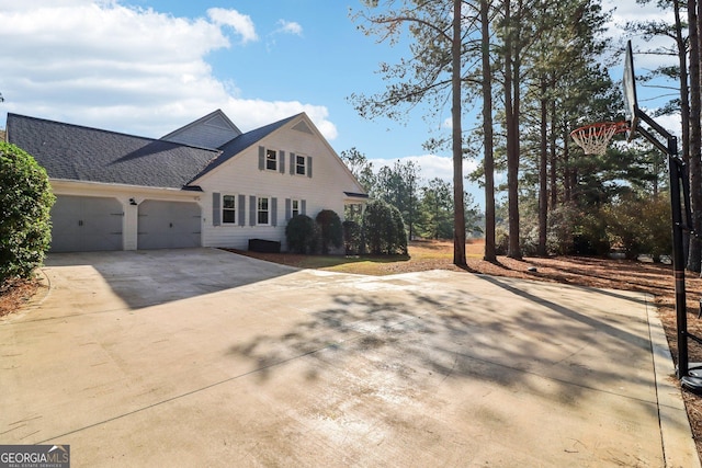 view of property exterior with a garage