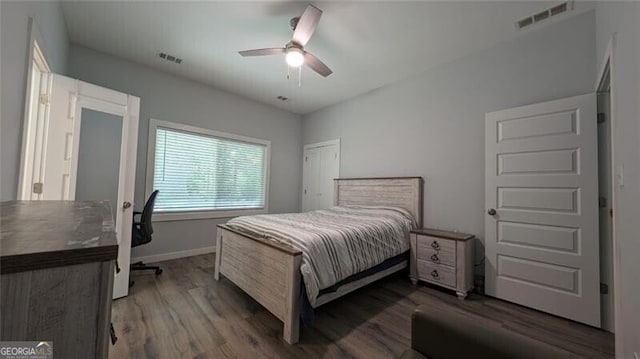 bedroom featuring hardwood / wood-style flooring and ceiling fan