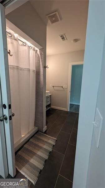 bathroom featuring tile patterned flooring