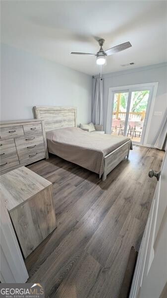 bedroom featuring dark hardwood / wood-style floors and ceiling fan