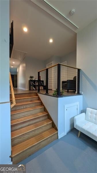 stairs featuring concrete floors