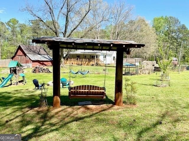 surrounding community featuring a playground and a lawn