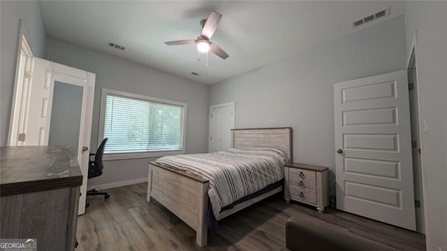 bedroom with hardwood / wood-style flooring and ceiling fan