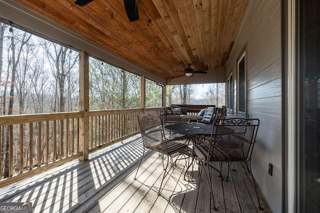 wooden deck featuring ceiling fan