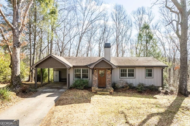 ranch-style home with a carport