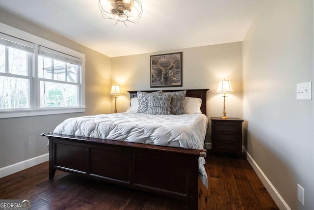 bedroom with dark wood-type flooring