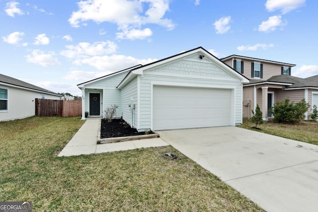 view of front of house featuring a garage and a front lawn