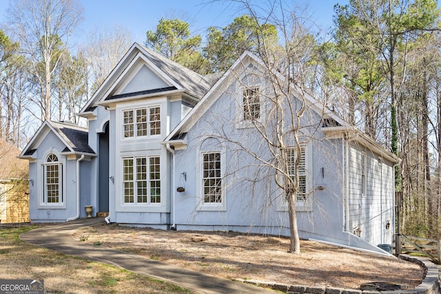 view of front facade featuring a shingled roof