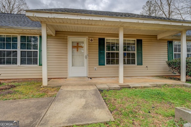 doorway to property featuring a porch